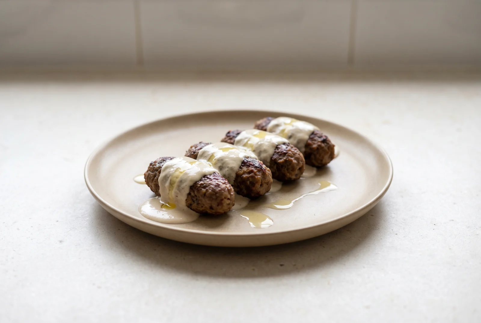 Kofta bil Tahini — Jordanian Baked Meatballs with Tahini Sauce